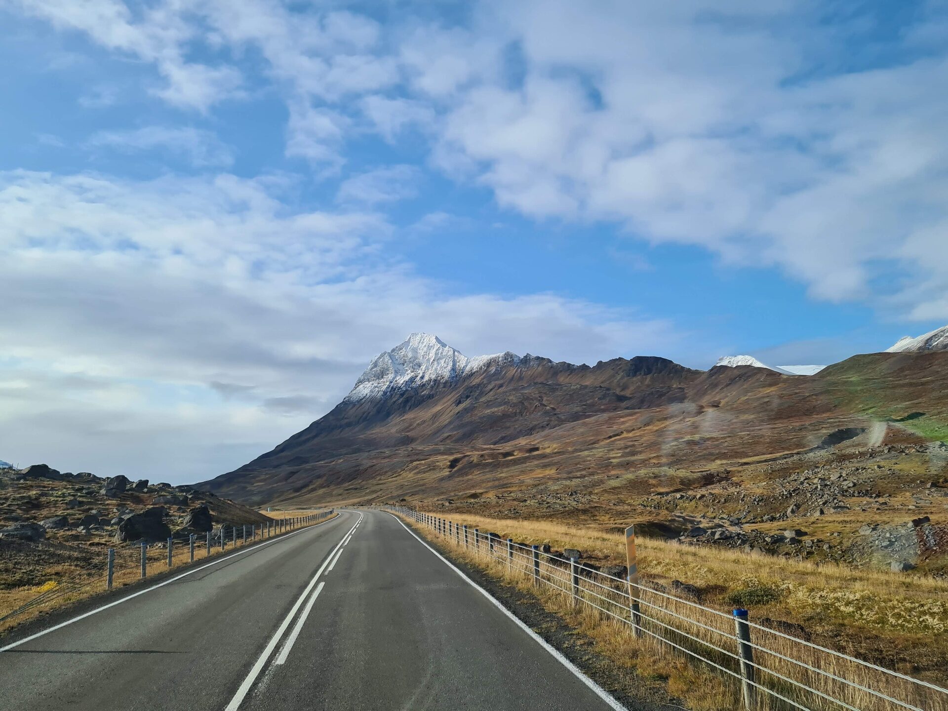 Empty Iceland road through a dramatic Iceland landscape